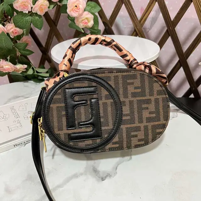 Oval-shaped Ladies Hand Bag