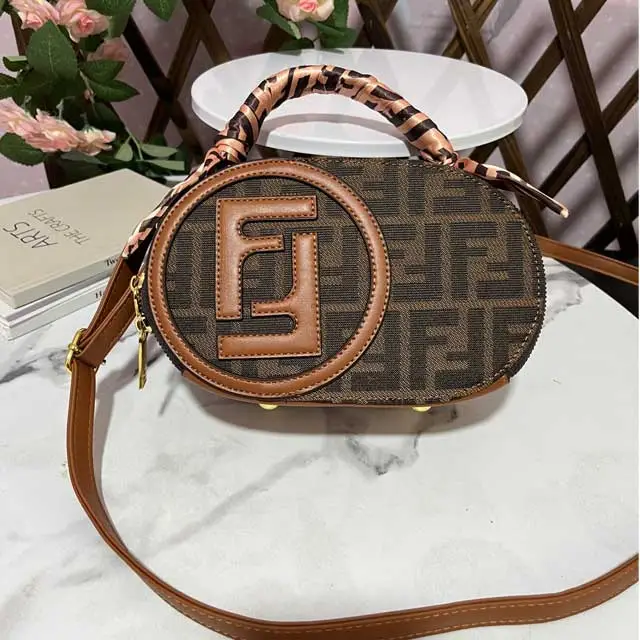 Oval-shaped Ladies Hand Bag