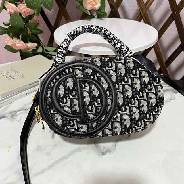 Oval-shaped Ladies Hand Bag