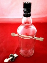 Arrow Through Bottle and Coin