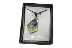 Gerbeera in translucent pendant