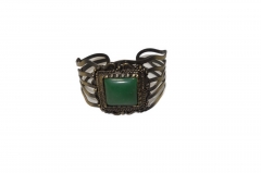 ROMAN STYLE BRASS BANGLE WITH LARGE GREEN STONE