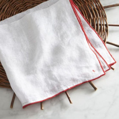 Stone washed linen cloth napkin with contrast color over lock stitch stripe napkin