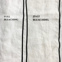 Stone washed linen cloth napkin with contrast color over lock stitch stripe napkin