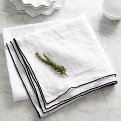 Stone washed linen cloth napkin with contrast color over lock stitch stripe napkin