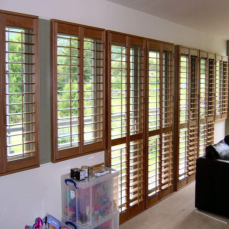 Grey wooden white louver plantation shutters for window and door