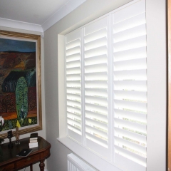 Grey wooden white louver plantation shutters for window and door