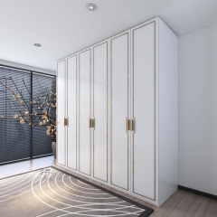 White painted casement closet with golden glazing