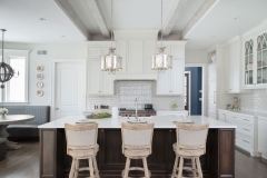 White painted transitional kitchen with dark wood island and farmhouse sink- Allandcabinet