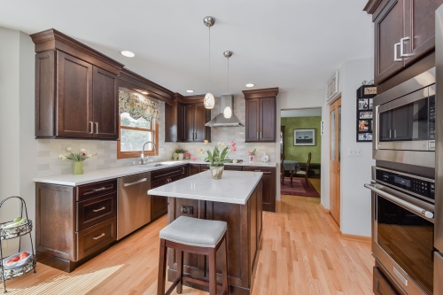 A traditional dark stained cherry wood kitchen -Allandcabinet