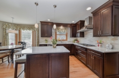 A traditional dark stained cherry wood kitchen -Allandcabinet