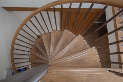 Farm barn spiral staircase with wood steps and steel rod railings-ALlandmetal