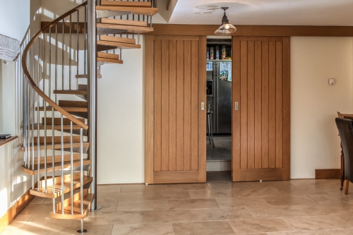 Farm barn spiral staircase with wood steps and ste...