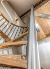 Farm barn spiral staircase with wood steps and steel rod railings-ALlandmetal