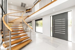 Wood Treads on white curved mono stringer curved staircase