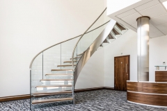 Single stringer curved staircase with wood treads and glass railing-Allandmetal