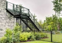 Exterior outdoor double stringer staircase with glass railing and wood tread