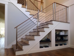 Infill stainless steel rod railing design with wood handrail