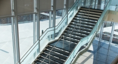 Frameless pitch fittings glass railing with steel standoff for corridor