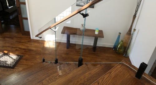 Black spigot glass railing frameless with solid wood handrail