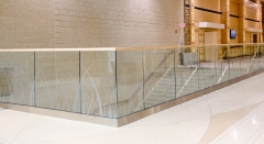 Modern glass railing with u channel aluminum for commercial corridor