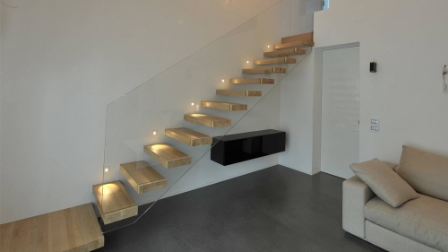 Straight floating staircase with invisible stairs stringer
