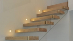 Straight floating staircase with invisible stairs stringer