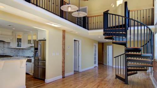 Wood and steel spiral staircase for small space