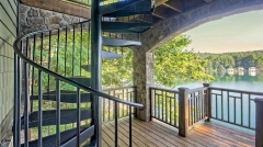 Steel black spiral staircase with contemporary grid plate stair treads