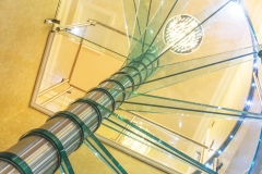 Helical glass staircase with glass railings for indoor