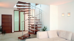 Spiral stair with curved solid rod steel railing