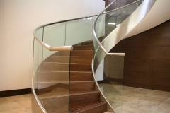 Contemporary stainless steel stringer curved staircase with glass balustrade