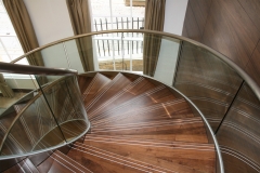 Contemporary stainless steel stringer curved staircase with glass balustrade