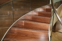 Contemporary stainless steel stringer curved staircase with glass balustrade