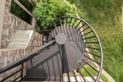 Metal spiral stairs for modern house exterior design