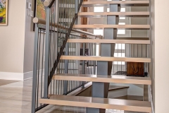 Galvanized mono stringer staircase with vertical steel railing