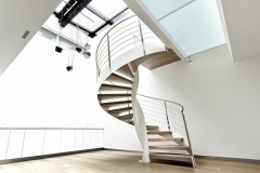 Center post side stringer spiral curved staircase with metal railing