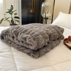 Plushed blanket with bubbles pattern