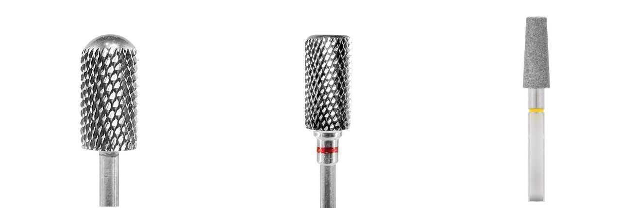 Three professional acrylic nail drill bits: safety bit, barrel bit, and tapered diamond bit.