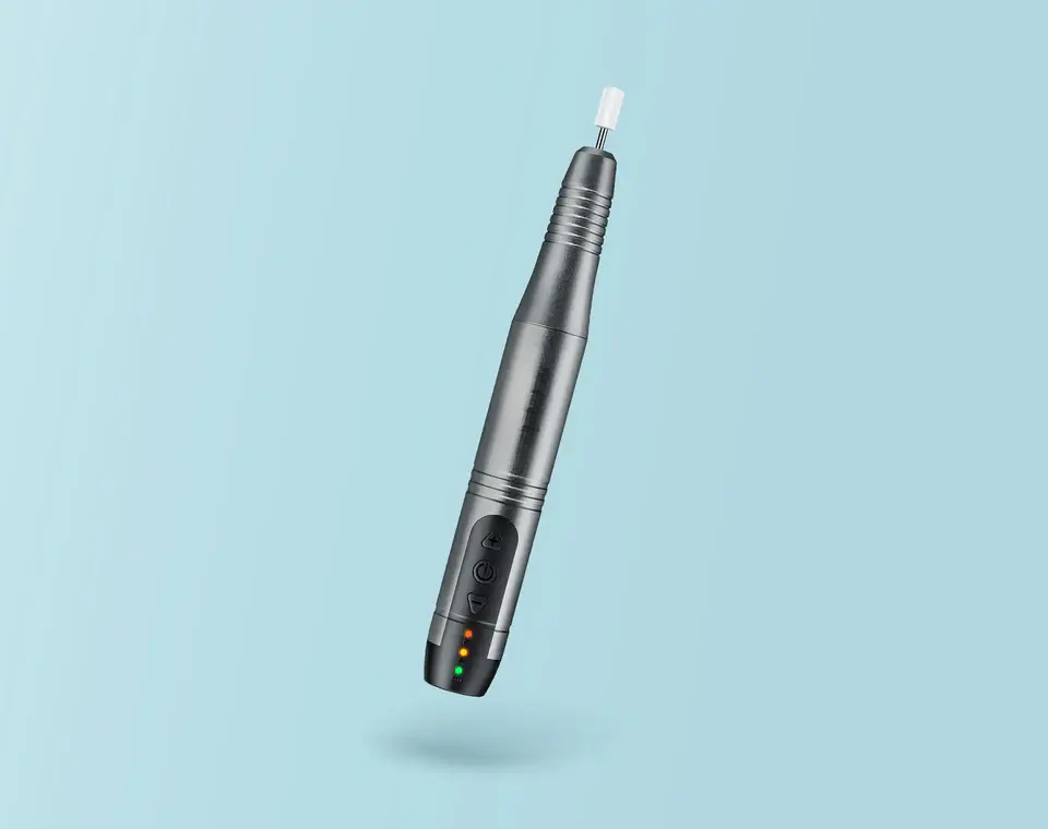 A single grey pen-style nail drill handpiece
