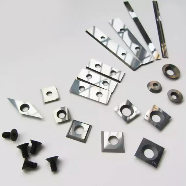 Tungsten carbide reversible inserts 