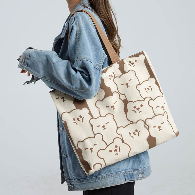 Female models carry fashionable custom promotional canvas bags