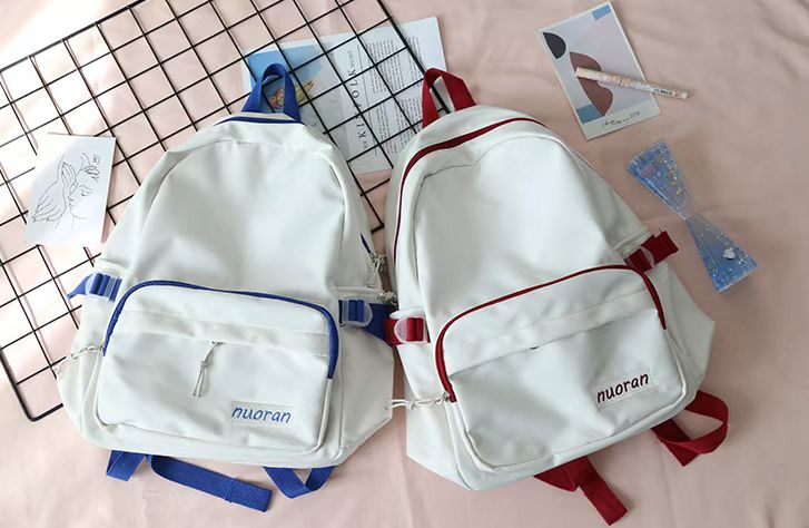 Personalized cotton backpack details with blue zipper and red zipper