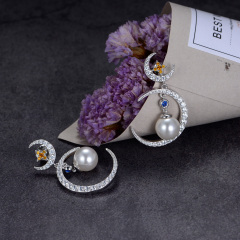 pearl star and moon stud earrings