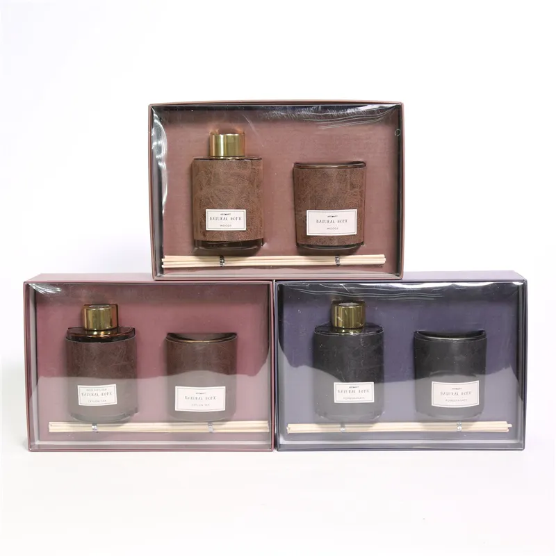 DESCRIPTION: 21.8X15.2X6.7CMH AROMA GIFT SET 1.D6X9.5CMH 80ML GLASS DIFFUSER W/WRAP +6PCS RATTAN 2. D6.2X7.5CMH DECORATED GLASS CANDLE COLOR/SCENT 1)GREY/POMEGRANATE； 2)BROWN/SEYLON TEA；3)LT.BROWN/WOODS