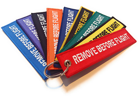 Colorful Remove before flight keychain