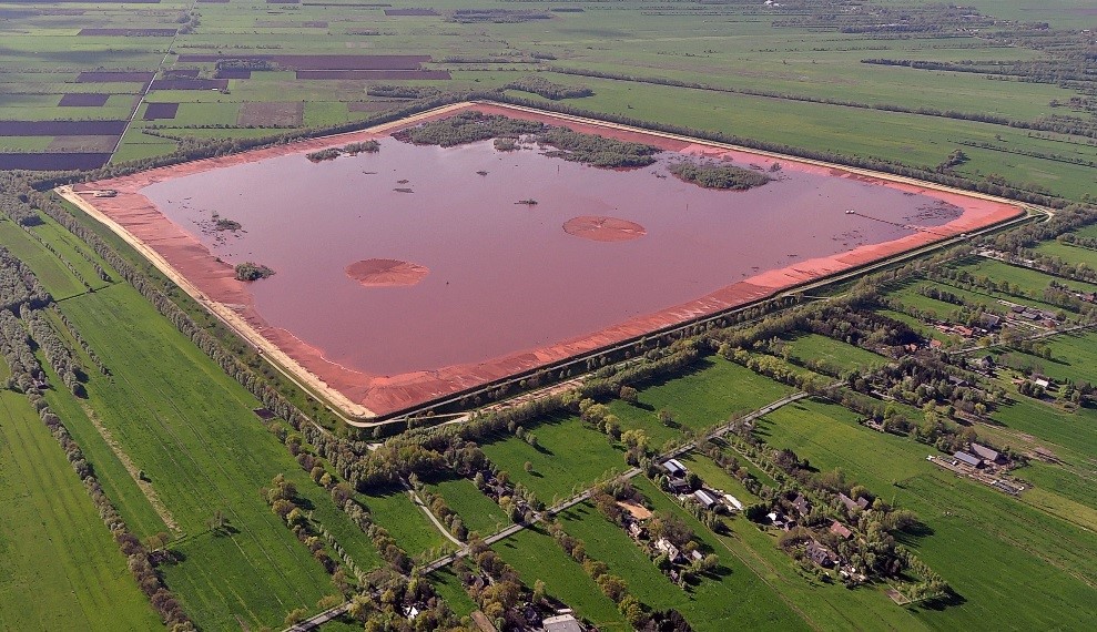 China’s Department of Energy Conservation conducts a symposium promoting red mud use