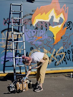 drawing graffiti with telescopic ladder 