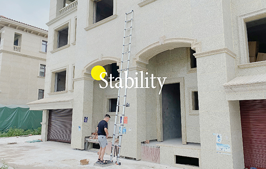 A man is preparing to climb up the second floor of a villa with a telescopic ladder 20ft