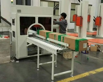 orbital tape wrapping machine for strapping cartons and boxes and bundles